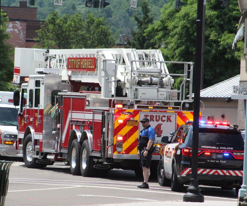 A Hornell police officer surveys the crowd at the July 4 parade. The city has been awarded a grant to help fund the purchase of new body armor for members of the Hornell Police Department.