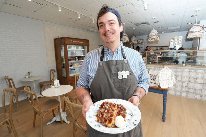 Culinary Director Jean-Louis Berthet with Maman's signature croissant waffles topped with a homemade caramel sauce and served with salted whipped butter at Maman in Rye July 22, 2026. This is the French-inspired all-day cafe's first Westchester location.