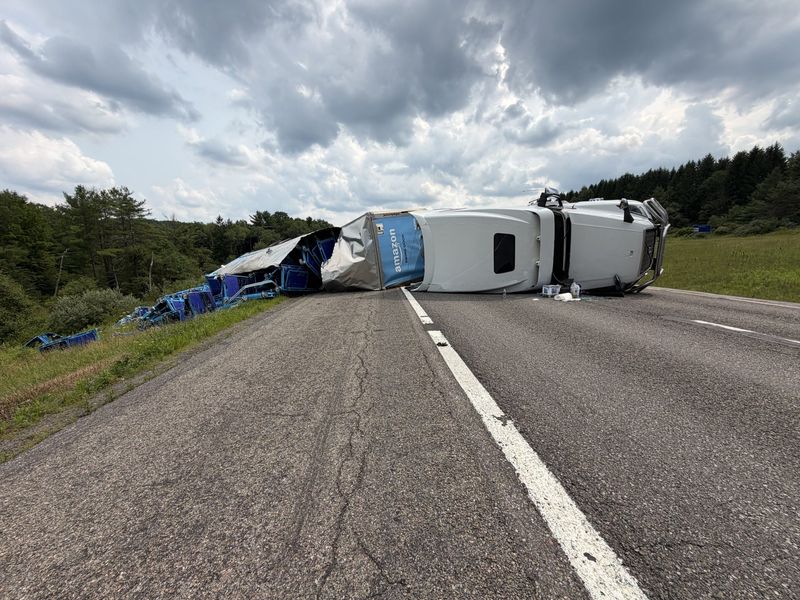 An overturned tractor trailer has shutdown both northbound lanes of I-81 in the Town of Barker.