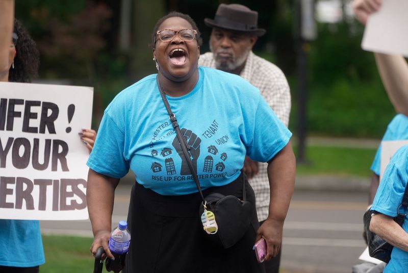 Yolanda Gavin, a member of the City-Wide Tenant Union of Rochester and tenant at Park Square, joins protesters outside Conifer on University Avenue on July 30, 2026 in Rochester.  Conifer owns Park Square, affordable housing located at 10 Manhattan Square Dr. where most of the protesters live.  They said that the building has many code violations.