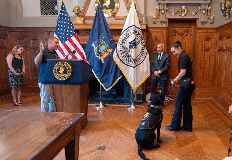 Yonkers mayor Mike Spano presides over the swearing in ceremony welcoming two new facility dogs to the police department at Yonkers City Hall on Tuesday, August 4, 2026.