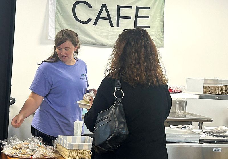 Employee Amanda Erickson serves a client at the Meals on Wheels Cafe, a new service provided by Meals on Wheels of Chemung County. The facility officially opened with a ribbon-cutting ceremony Wednesday, Aug. 5, 2026.