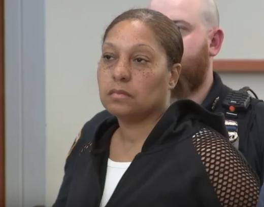 Jennifer Lackard at her arraignment in Bronx Criminal Court Aug. 4, 2026, on indictment accusing her and her husband of driving their son to and from a gang related shooting outside the same courthouse five weeks earlier. She was fired as Mount Vernon deputy police commissioner.