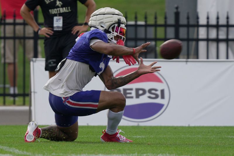 Bills DJ Moore, after slipping on the turf, gets up and makes the catch at Buffalo Bills Training Camp at St. John Fisher University in Pittsford on Aug. 6, 2026.