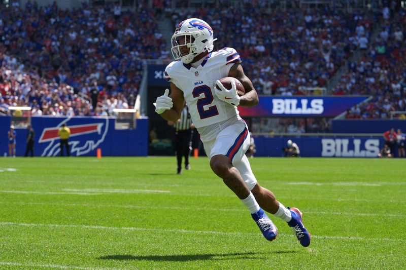 Buffalo Bills wide receiver DJ Moore (2) runs with the ball after making a catch aginst the Carolina Panthers during the first half at New Highmark Stadium.