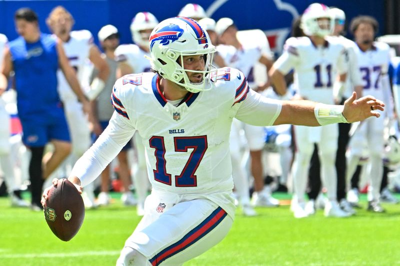 Buffalo Bills quarterback Josh Allen (17) moves out of the pocket against the Carolina Panthers in the first quarter at the New Highmark Stadium.