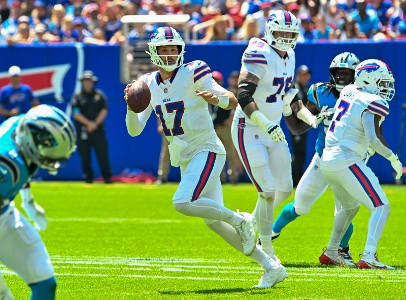 Aug 15, 2026; Orchard Park, New York, USA; Buffalo Bills quarterback Josh Allen (17) moves in the pocket to throw a pass in the first quarter against the Carolina Panthers at the New Highmark Stadium. Mandatory Credit: Mark Konezny-Imagn Images