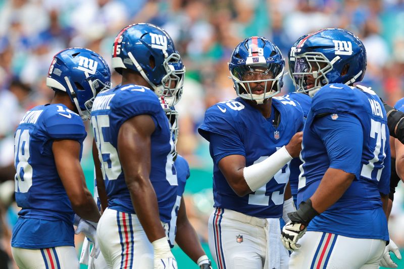 Aug 22, 2026; Miami Gardens, Florida, USA; New York Giants quarterback Jameis Winston (19) speaks to his teammates against the Miami Dolphins during the first half at Hard Rock Stadium. Mandatory Credit: Sam Navarro-Imagn Images