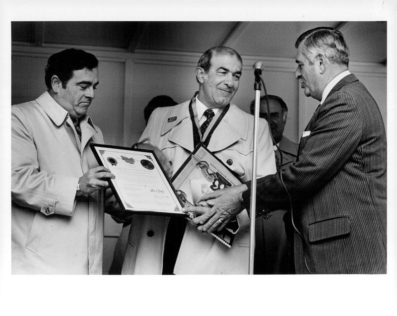Former Rochester Red Wings manager Joe Altobelli accepts an honor from Monroe County Manager Lucien Morin, right, and Rochester Mayor Tom Ryan in this 1983 file photo.