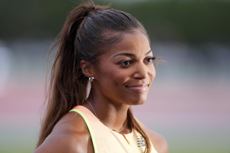 FILE PHOTO: May 3, 2025; Miramar, FL, USA; Gabby Thomas aka Gabrielle Thomas (USA) reacts after winning the short sprints women's 200m in 21.95 during the Grand Slam Track Miami at Ansin Sports Complex. Mandatory Credit: Kirby Lee-Imagn Images/File Photo
