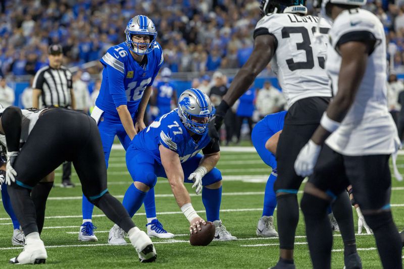 FILE PHOTO: Nov 17, 2024; Detroit, Michigan, USA; Detroit Lions quarterback Jared Goff (16) lines up for the snap behind center Frank Ragnow (77) during the first half of the game against the Jacksonville Jaguars at Ford Field. Mandatory Credit: David Reginek-Imagn Images