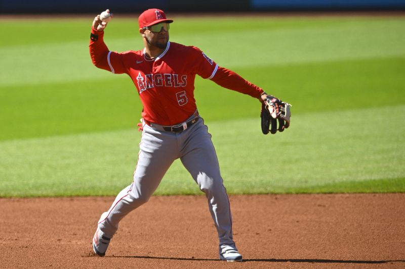 May 31, 2025; Cleveland, Ohio, USA; Los Angeles Angels third baseman Yoan Moncada (5) throws to first base in the first inning against the Cleveland Guardians at Progressive Field. Mandatory Credit: David Richard-Imagn Images