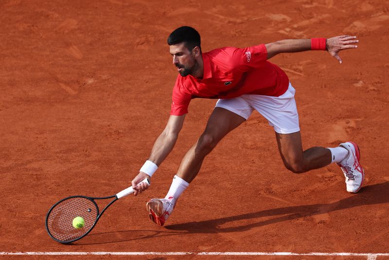 FILE PHOTO: Tennis - French Open - Roland Garros, Paris, France - June 2, 2025 Serbia's Novak Djokovic in action during his fourth round match against Britain's Cameron Norrie REUTERS/Gonzalo Fuentes/File Photo