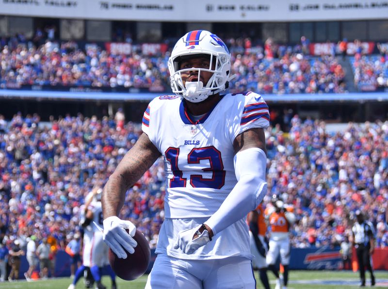FILE PHOTO: Aug 20, 2022; Orchard Park, New York, USA; Buffalo Bills wide receiver Gabriel Davis (13) celebrates scoring a touchdown in the first quarter of a pre-season game against the Denver Broncos at Highmark Stadium. Mandatory Credit: Mark Konezny-USA TODAY Sports/File Photo