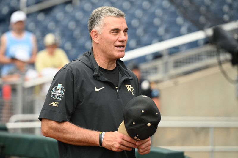FILE PHOTO: Jun 17, 2023; Omaha, NE, USA; Wake Forest Demon Deacons head coach Tom Walter on the field before a game against the Stanford Cardinal at Charles Schwab Field Omaha. Mandatory Credit: Steven Branscombe-USA TODAY Sports