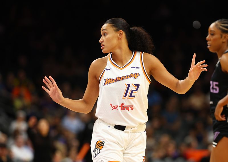 FILE PHOTO: May 11, 2025; Phoenix, AZ, USA; Celeste Taylor (12) against the Golden State Valkyries during a preseason game at PHX Arena. Mandatory Credit: Mark J. Rebilas-Imagn Images