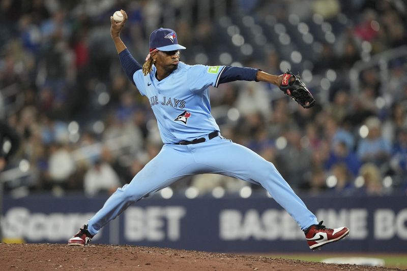 FILE PHOTO: May 29, 2025; Toronto, Ontario, CAN; Toronto Blue Jays pitcher Jose Urena (48) pitches to the Athletics during the eighth inning at Rogers Centre. Mandatory Credit: John E. Sokolowski-Imagn Images
