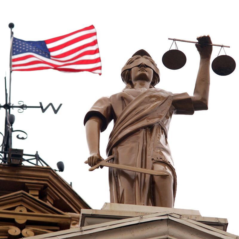 An American flag flies behind Lady Justice in this undated Advocate file photo outside the Licking County Courthouse in Newark