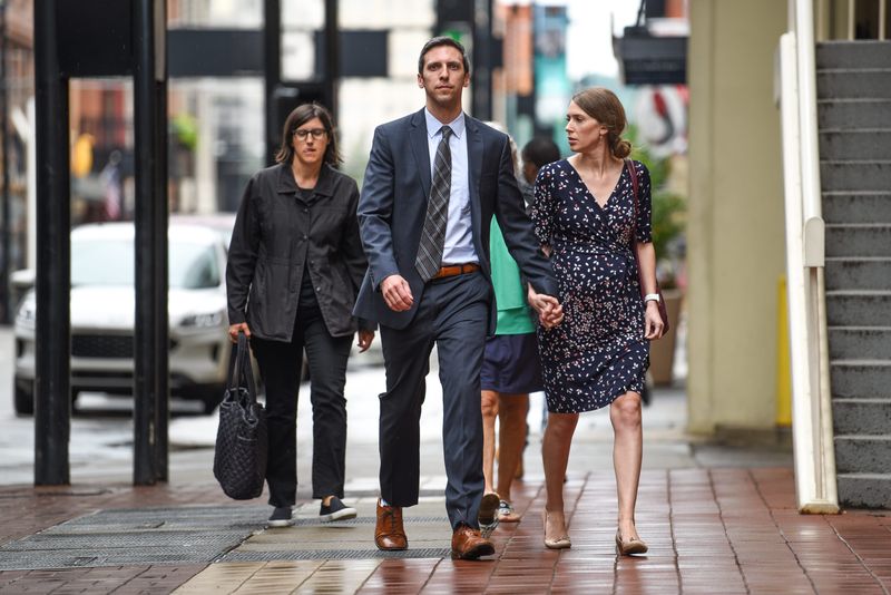 Former Cincinnati City Councilman P.G. Sittenfeld walks into federal court alongside his wife, Dr. Sarah Coyne, on Friday July 8, 2022, as a verdict in his public corruption was reached. He was found guilty on two of six counts.