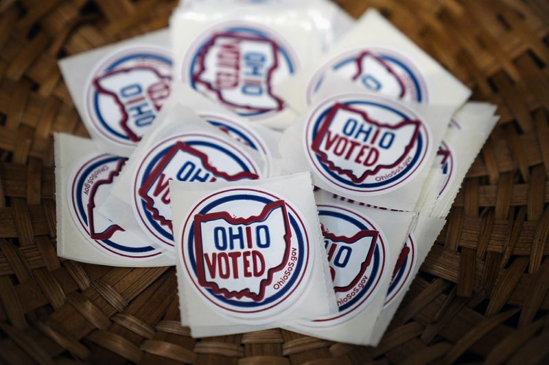 Aug 2, 2022; Columbus, Ohio,USA; The Ohio Voted stickers sit in a basket during the Primary elections at United Methodist Church in Hilliard on August 2, 2022.