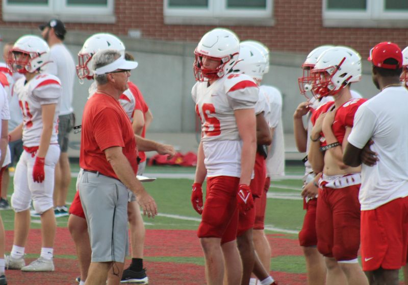 Noel Rash talks to Beechwood players during preseason practice in 2022, his final season there.