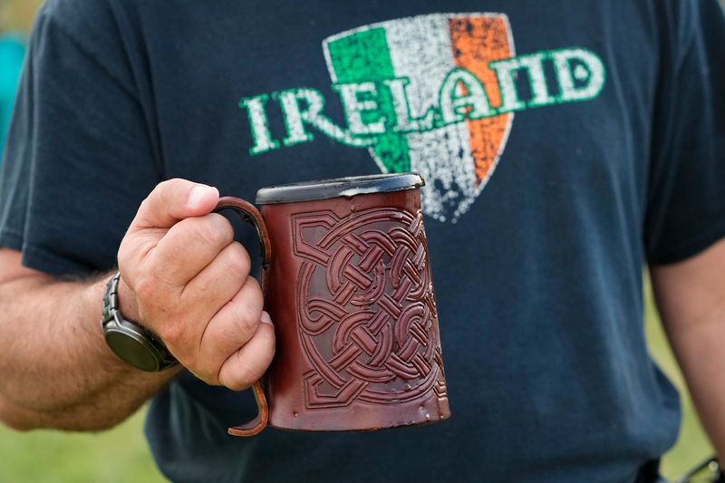 Aug 5, 2022; Dublin, Ohio, USA; Mike Murphy of the Northwest Side carries a mug of Guinness beer during the 35th annual Dublin Irish Festival. Mandatory Credit: Adam Cairns-The Columbus Dispatch