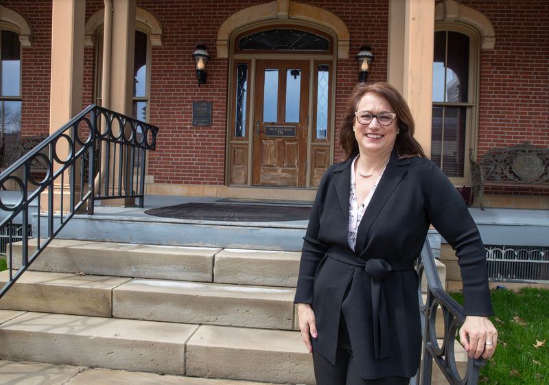 Patty Dowd Schmitz, president and CEO of the National First Ladies Library & Museum, is shown outside the Ida Saxton McKinley house in downtown Canton in 2023. Schmitz is leaving the organization.