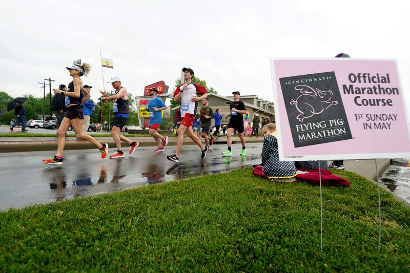 Participants run along Columbia Parkway out of Fairfax during the 2023 Flying Pig Marathon.