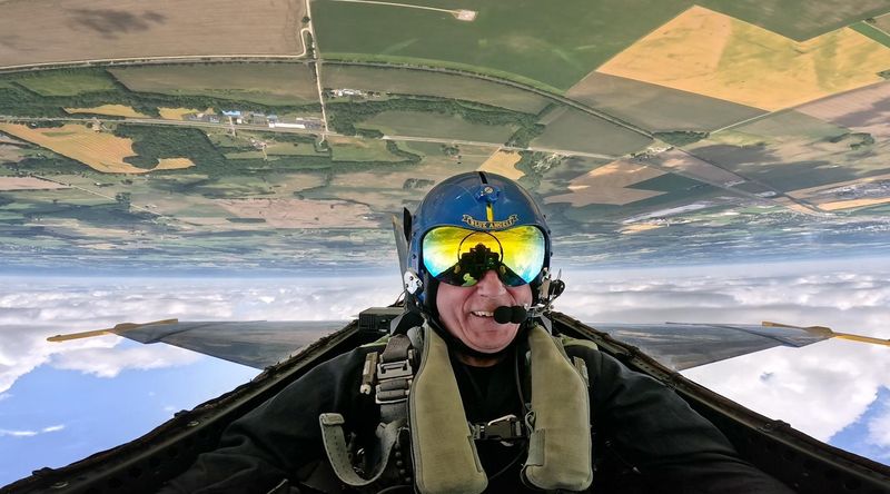 June 14, 2023; Columbus, Ohio, USA; Columbus Dispatch photographer Doral Chenoweth flies over Pickaway CO during a U.S. Navy Blue Angels flight Wednesday, June 14, 2023. He flew in a media demonstration flight in advance of the Columbus Air Show being held at Rickenbacker International Airport June June 16-18. He passed out three times during the maneuvers, but never threw up. Mandatory Credit: Doral Chenoweth-The Columbus Dispatch