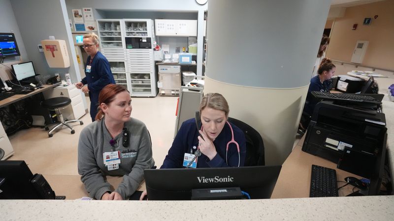 OhioHealth Grant Medical Center nurses Rochelle Brooks (left) and Sarah Bring, a Columbus State Community College nursing graduate, work on the cardiac intermediate unit at the Downtown hospital in 2023.
