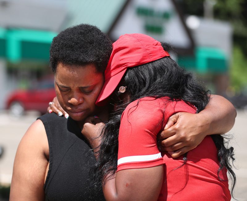 Sandy Hatcher, sister of Ernestine Stallings, comforts Stallings' girlfriend Tasha Love as she talks about the shooting death of Stallings. Stallings, 34, who was shot and killed July 3, 2023, as she was leaving the Dollar Tree in Akron.