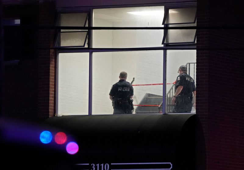 Columbus police officers are seen investigating inside an apartment building at 3110 East Livingston Avenue after a shooting involving at least one Columbus police officer and one Franklin County Sheriff's deputy Saturday evening left one person dead. The shooting happened around 8 p.m. in the 3000 and 3100 blocks of East Livingston Avenue, near James Road.