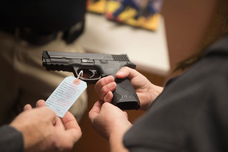 File photo: Customers shop for a handgun at Metro Shooting Supplies on November 12, 2014, in Bridgeton, Missouri.