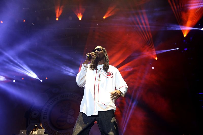 Snoop Dogg wears former Reds player, Deion Sanders' jersey No. 21 as he performs on the Yeatman's Cove Stage during Bunbury Music Festival Sunday night.