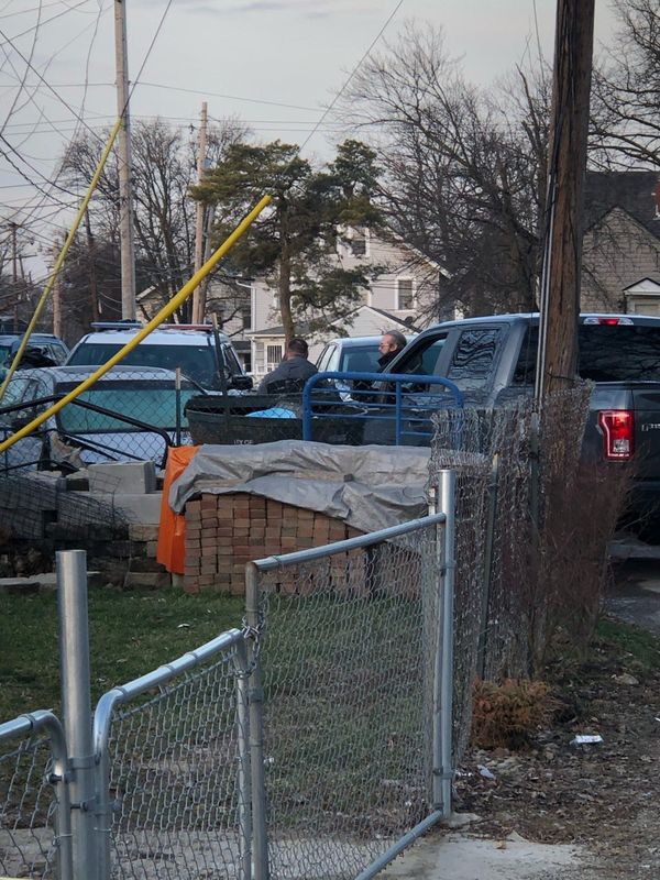 Columbus police investigators outside a home in the 2400 block of Sullivant Avenue on Jan. 14, 2021, hours after police were called around 11 p.m. on Jan. 13, 2021, to the house where the bodies of two murdered people were recovered from the basement.