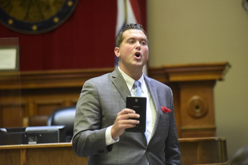 Defense attorney Adam Stone holds an electronic tablet that had been submitted as evidence in the Joshua Benedict trial during his closing arguments Friday, April 30, 2021.