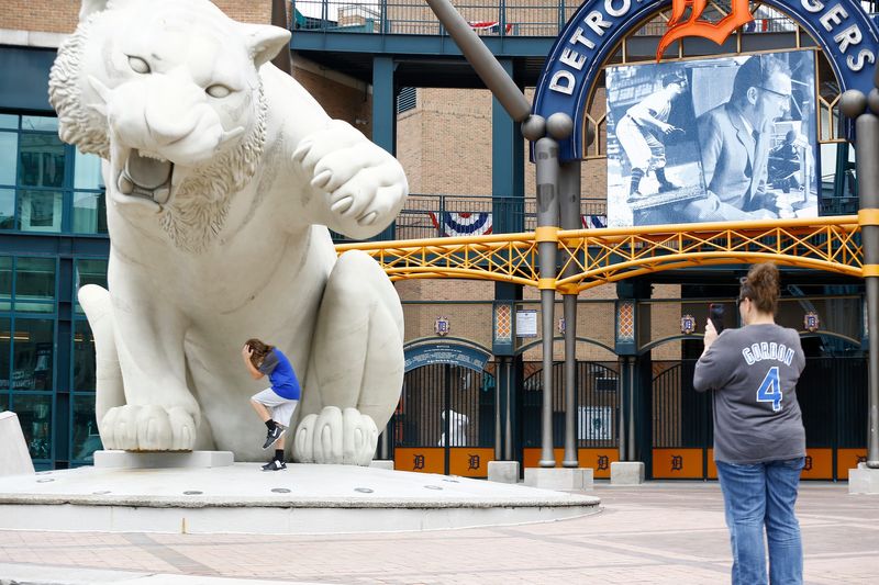 Mom and son from Kansas City take photos in front of the big tiger statue during Detroit Tigers' Opening Day at Comerica Park on Monday, July 27, 2020.