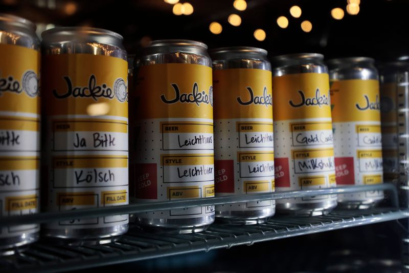 Half-growler cans of beer inside a refrigerator on Monday, Nov. 23, 2020 at Jackie O's Beer Store in Columbus, Ohio. The Athens, Ohio-based brewery is opening up a retail space with plans to expand into a beer garden and event space. The Beer Store, located in the former Elevator Brewing Company taproom at 165 N. 4th St., opens for curbside pickup on Tuesday.