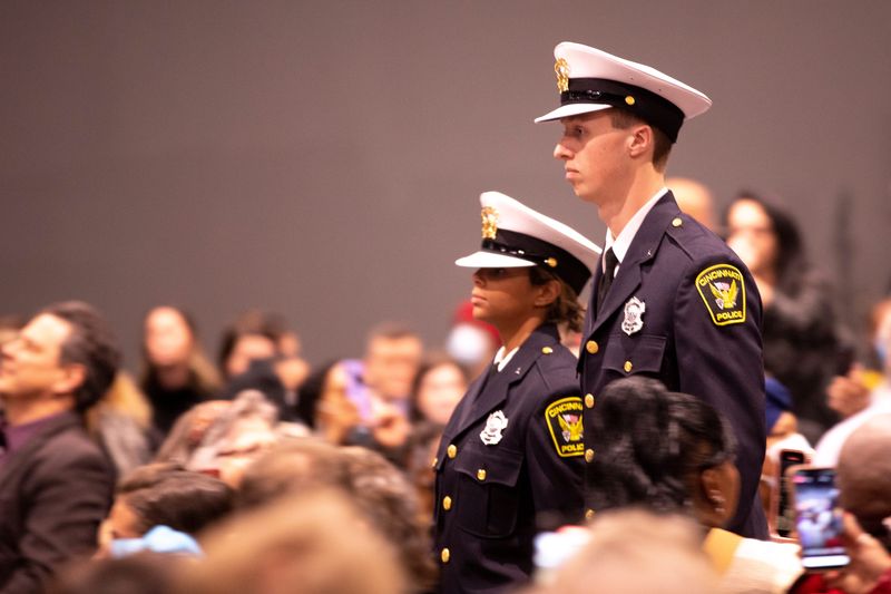 Cincinnati Police Officer Sean Henderson processes in during the Cincinnati Police Department's 111th Recruit Class Graduation Ceremony on Friday, Feb. 4, 2022, in Cincinnati. John Brown II, the recruit class president, suffered a medical emergency on January 17, 2022, and is still hospitalized. Cincinnati Police Department graduated 46 recruits.