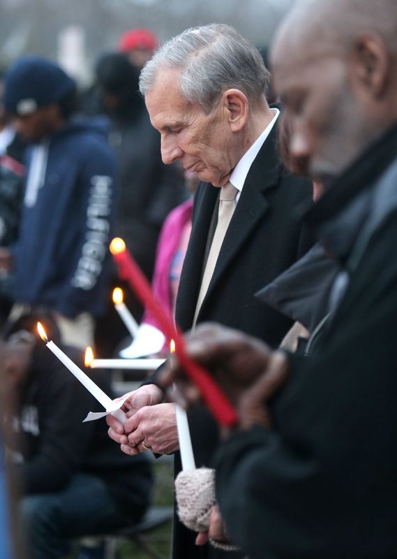 Thomas M. Bernabei, mayor of Canton, holds a candle during a vigil for 14-year-old Sylvia McGee at the Southeast Community Center in Canton on Friday, April 5, 2019. The youth as shot and killed on Bieyl Court SW Saturday. (CantonRep.com / Scott Heckel)