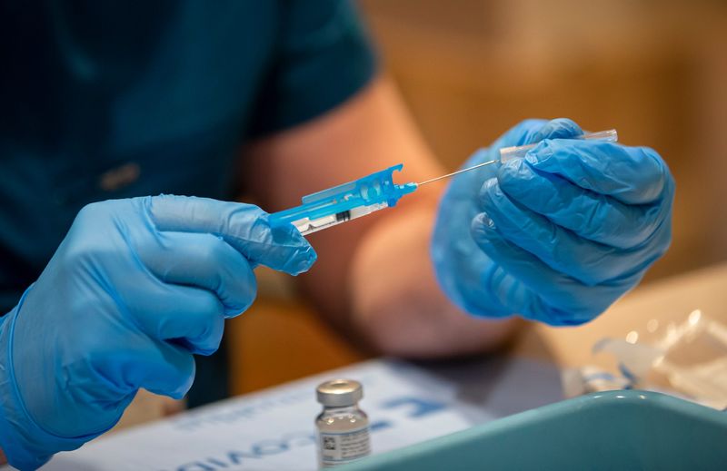 Pharmacist Eamonn Kerrigan prepares doses of the Moderna COVID-19 vaccine at Mount Carmel East hospital in Columbus on Wednesday, Feb. 17, 2021.