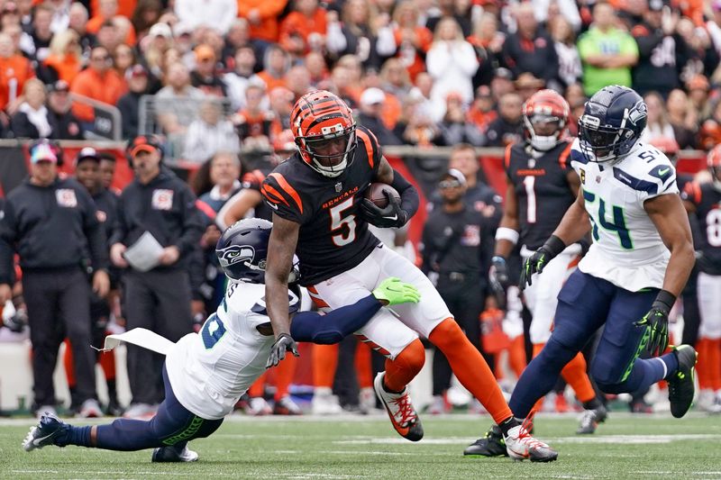 Cincinnati Bengals wide receiver Tee Higgins (5) turns downfield after completing a catch in the first quarter during an NFL football game between the Seattle Seahawks and the Cincinnati Bengals Sunday, Oct. 15, 2023, at Paycor Stadium in Cincinnati.