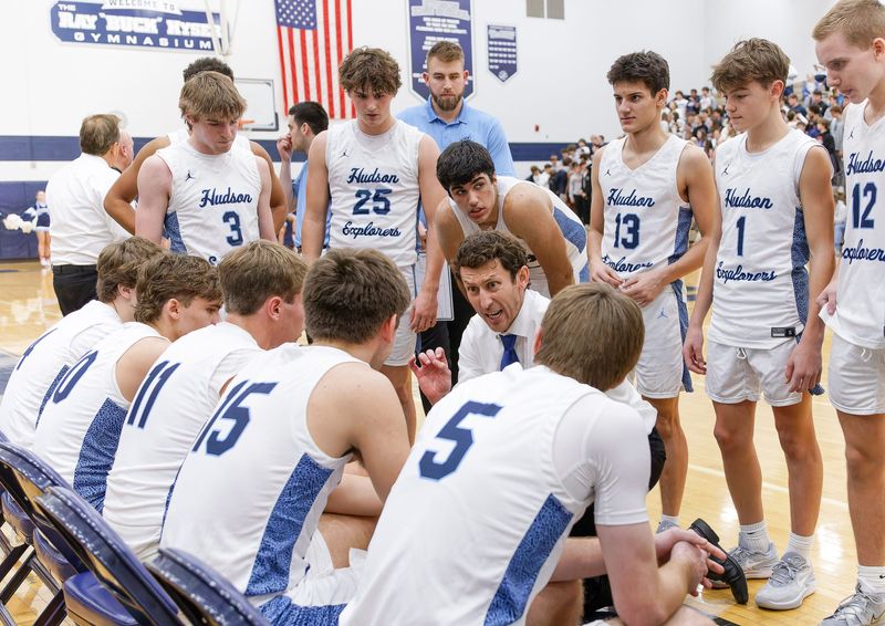 Hudson boys basketball coach Mike Brown talks to his players during a timeout in a home game against Kent Roosevelt on Friday, Dec. 1, 2023.