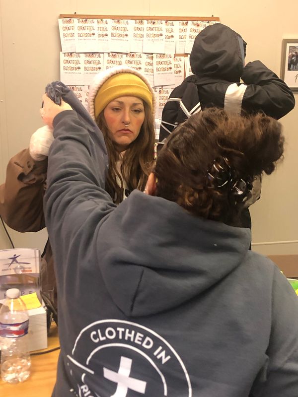 Nikki Welsh, 32, of Alliance, getting supplies from Clothed in Righteousness on Monday, Jan. 22, 2024, has been homeless for at least six months. She has four children, now in the foster care system. "I just want a safe place," she said, to get her life back on track.