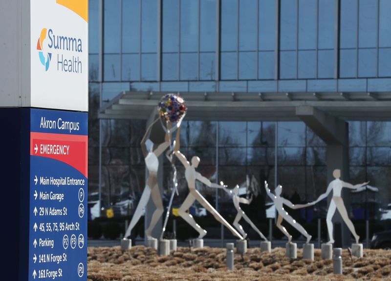 The statue entitled Beacon of Well-Being by Stephen Canneto stands in front of the Summa Health Akron Campus main entrance on Monday, March 25, 2024, in Akron.