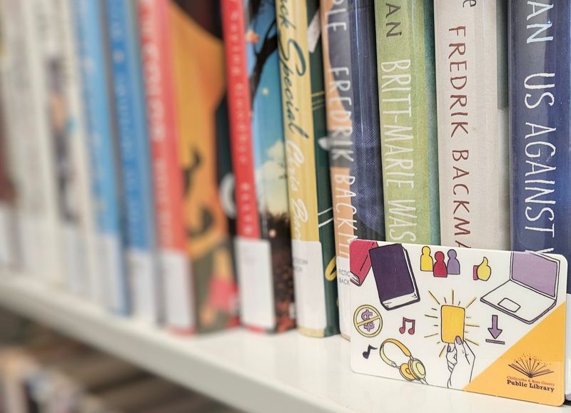 A library card for the Chillicothe & Ross County Public Library sits amongst books.