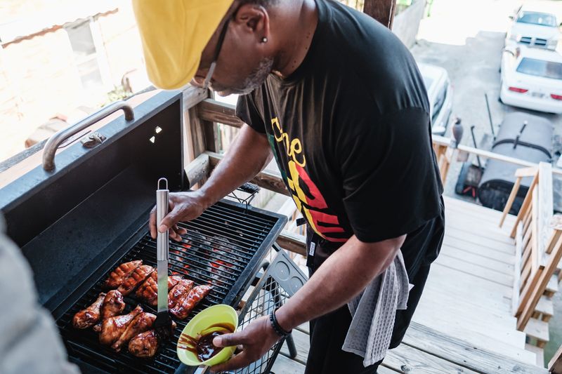 Rodney Sutton showed The Times-Reporter how he prepares ribs and chicken prior to this cooking demonstration at the farmers market in 2024.