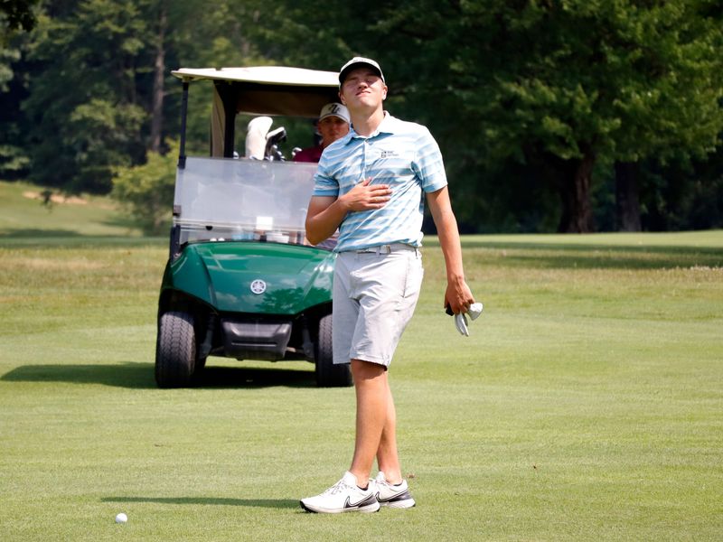 Noah Dever reacts to a shot during the second round of the Zanesville District Golf Association Amateur tournament on Saturday, June 22, 2024, at Cambridge Country Club.