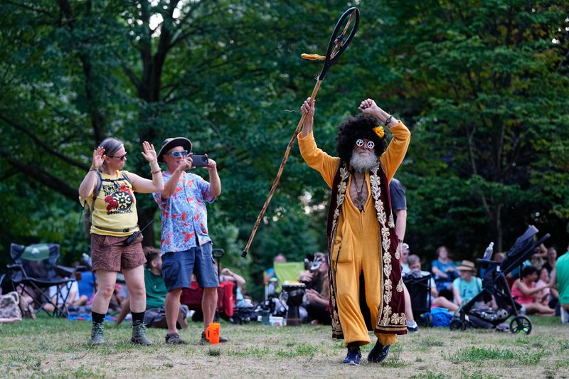 A festivalgoer is moved by the music at ComFest in 2024. This year's festival will take place June 27-29 in Goodale Park.