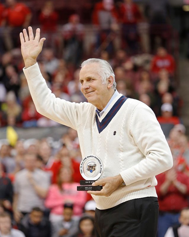 Ohio State basketball great Jerry Lucas waves to the crowd after being recognized for his performances in the NCAA Tournament during the Buckeyes game against Minnesota on February 20, 2013.